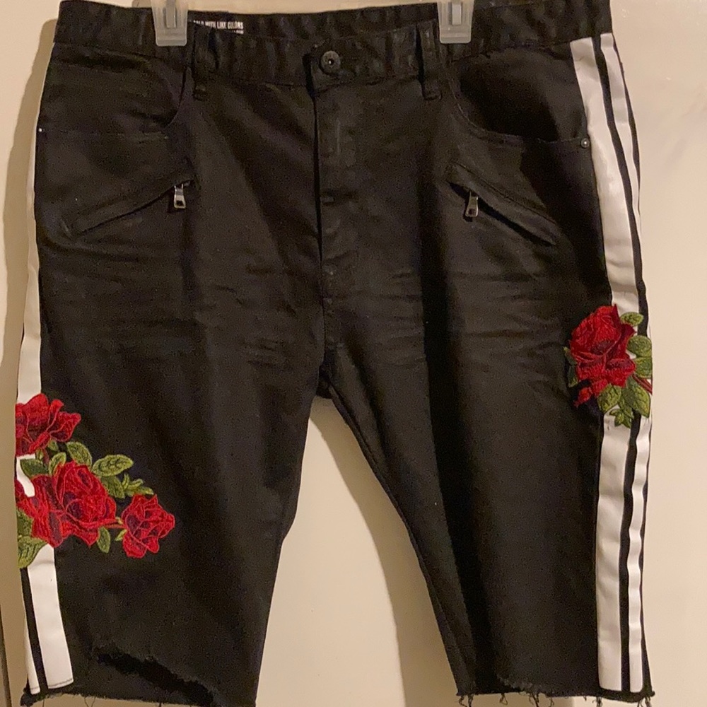 Black jean shorts with roses